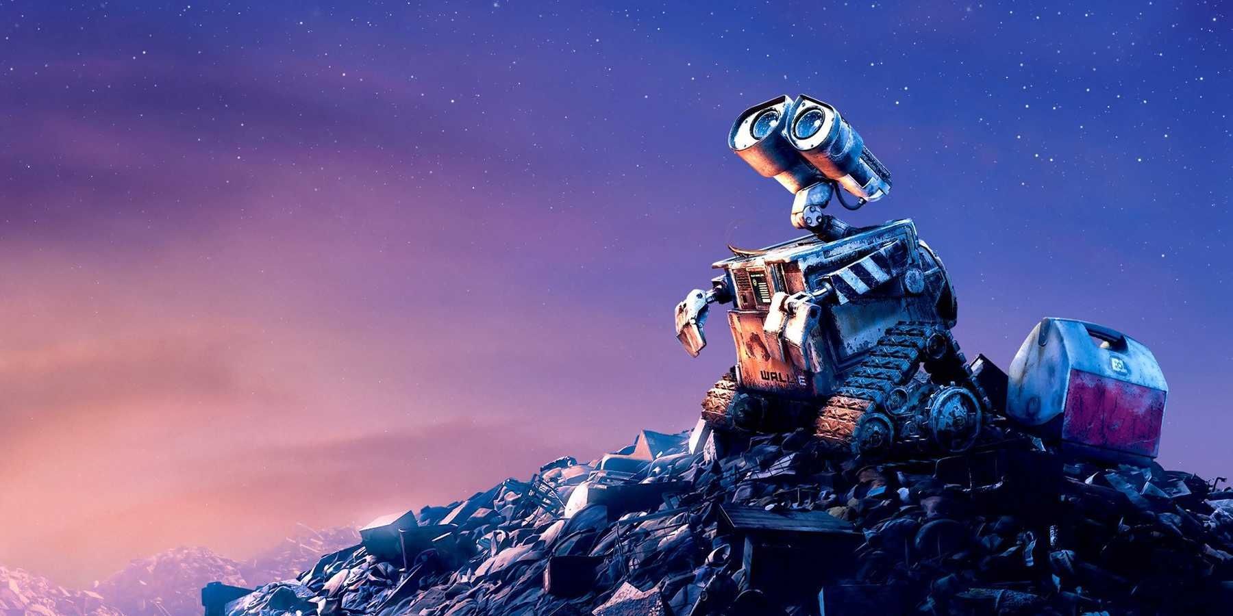 Wall E SITTING ON TOP OF A PILE OF TRASH