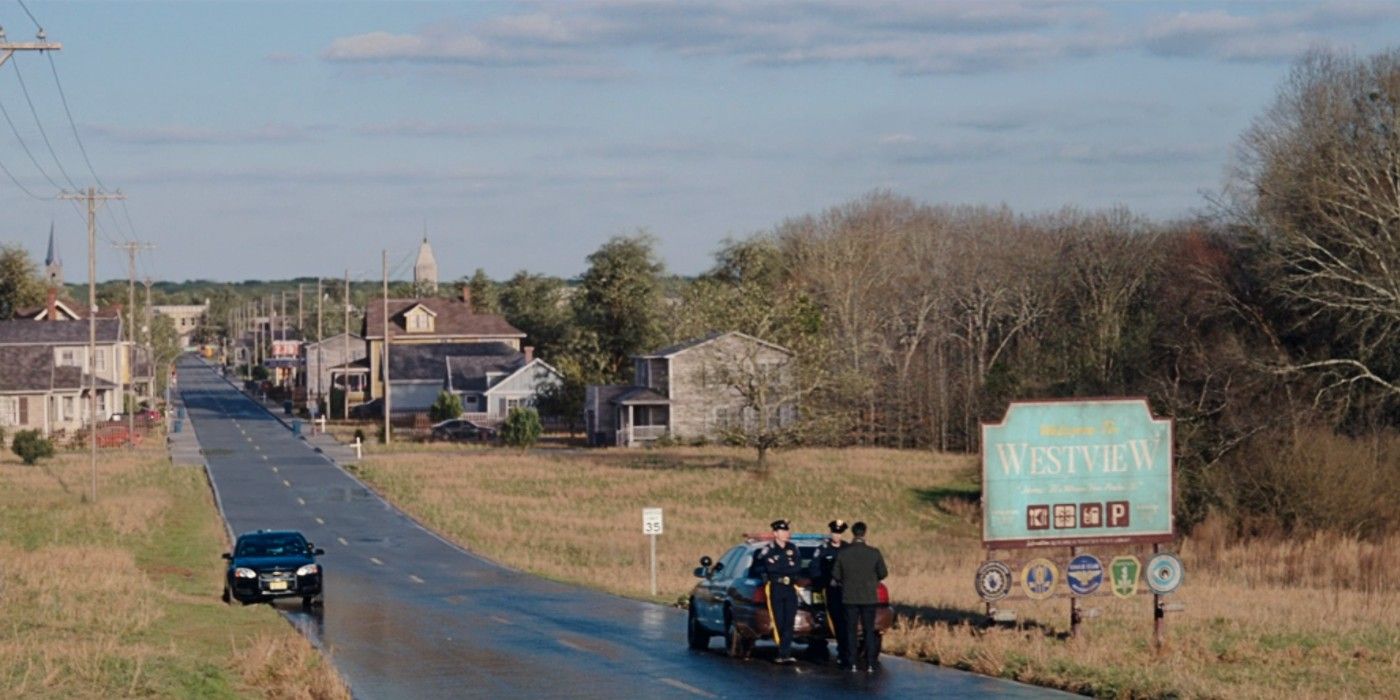 The outskirts of Westview has a few police officers standing at the city sign in WandaVision