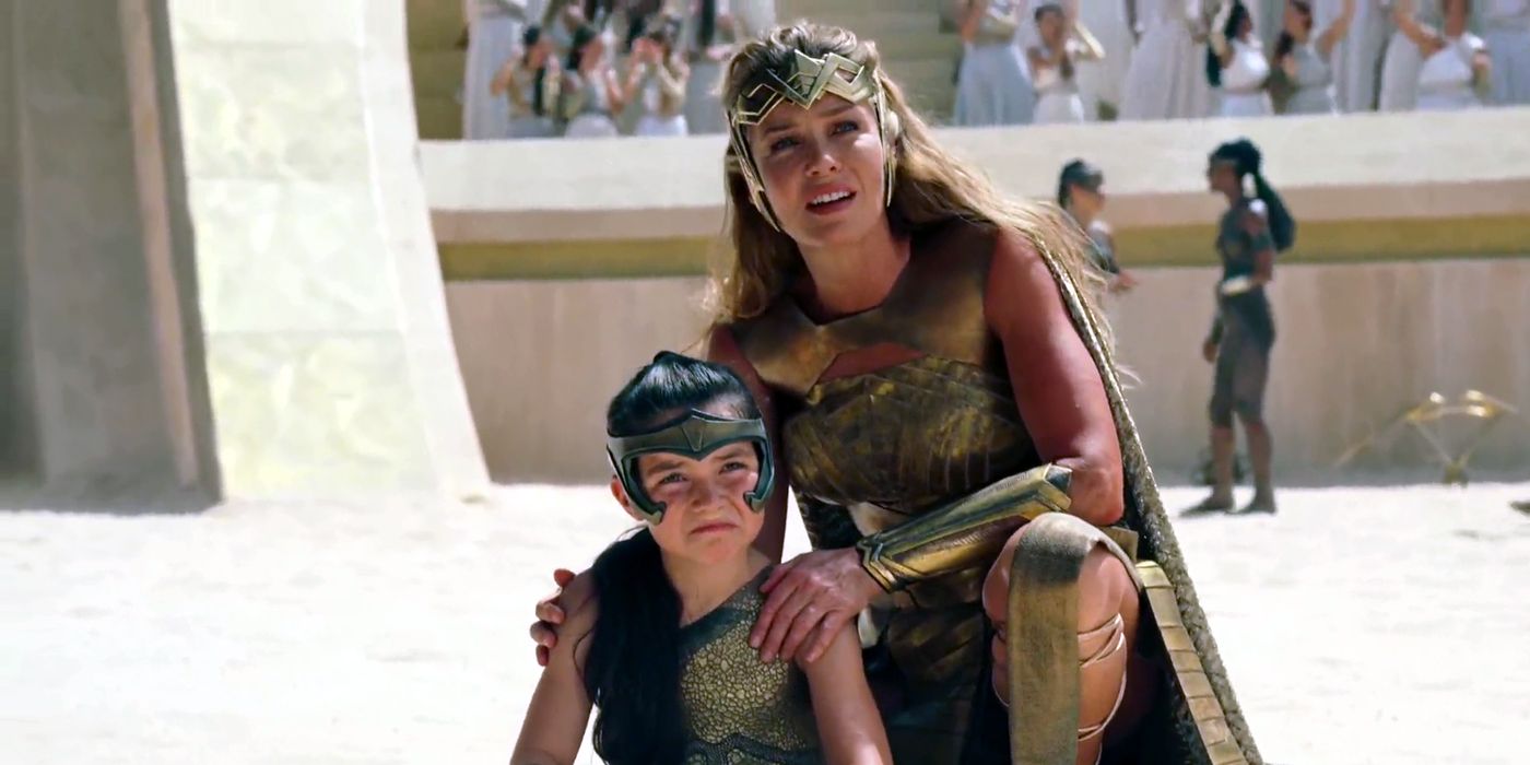 Hippolyta Kneeing Down Next To A Young Diana During Amazon Games Flashback Wonder Woman 1984 