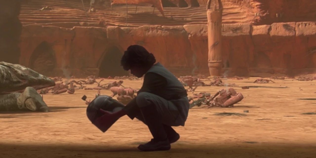 Young Boba Fett holds a helmet in Star Wars Attack of the Clones