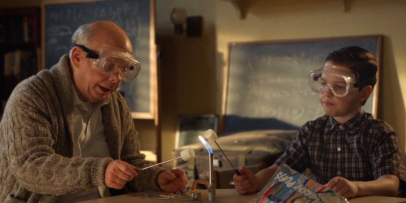 Dr. Sturgis and Sheldon in Young Sheldon wearing goggles and doing science work together.
