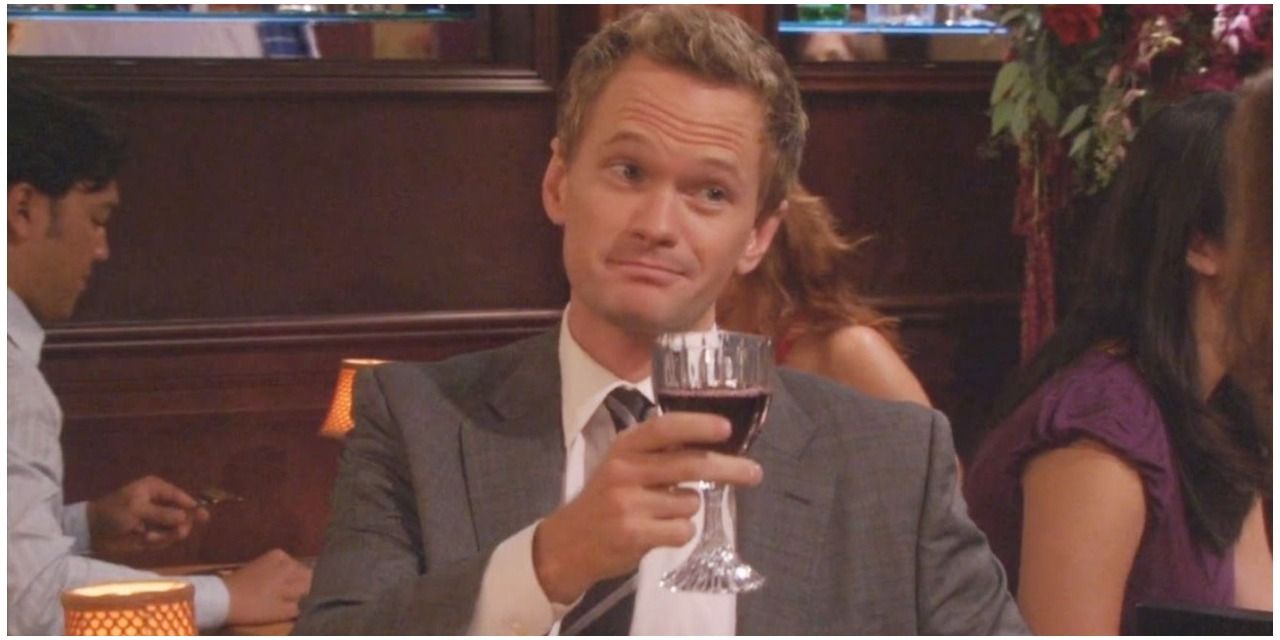 Barney from How I Met Your Mother holding a drink