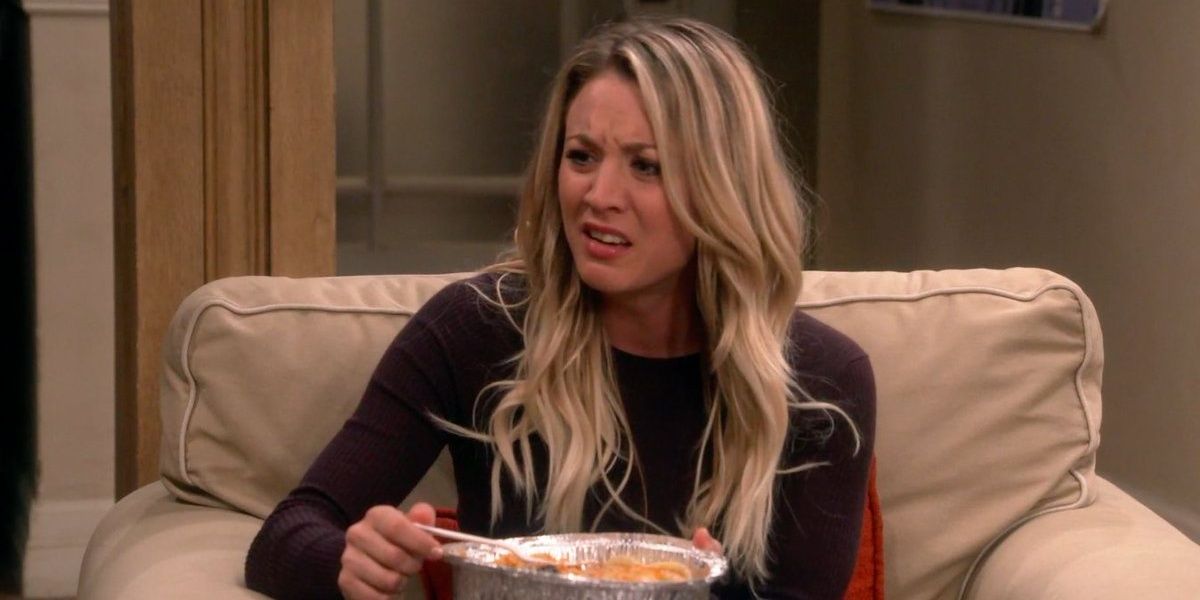 Penny looking upset and holding food on The Big Bang Theory