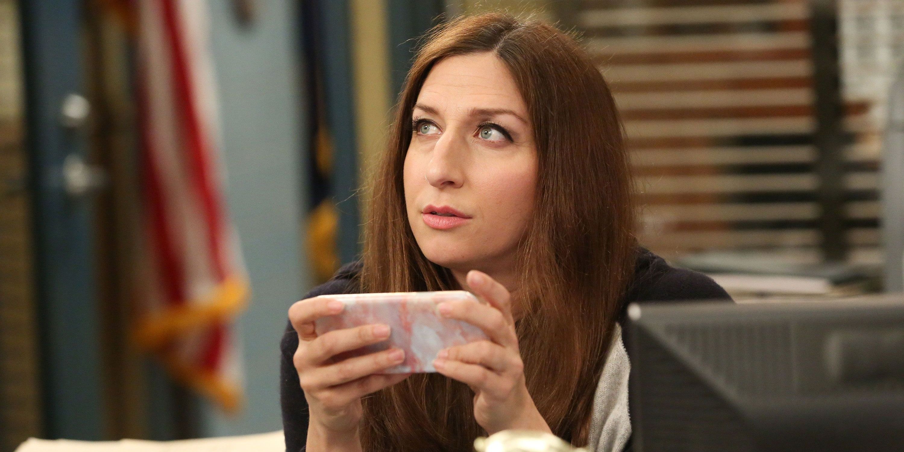 Gina holding up a mug on Brooklyn Nine-Nine