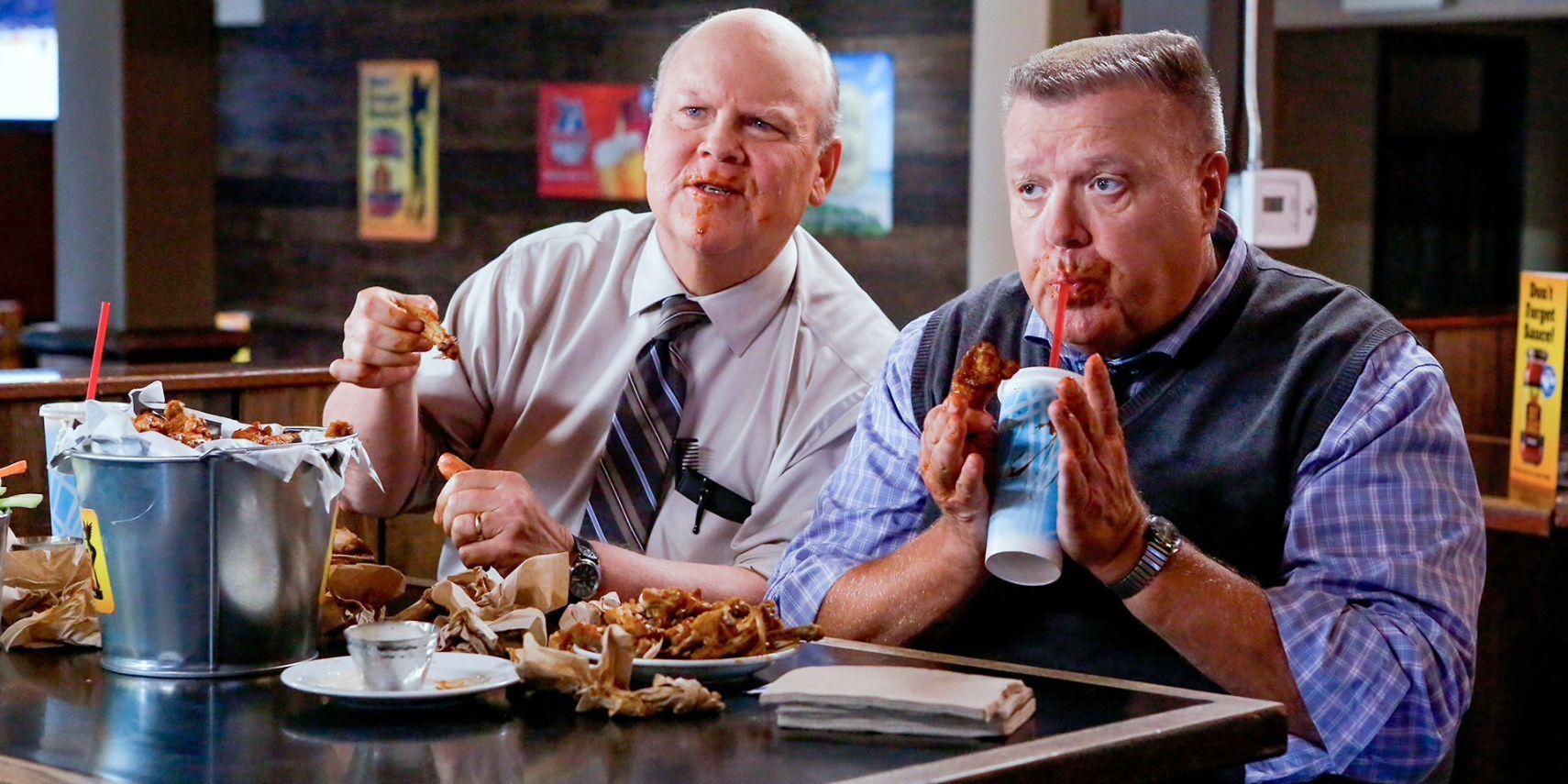 Hitchcock and Scully eating junk food together on Brooklyn Nine-Nine 