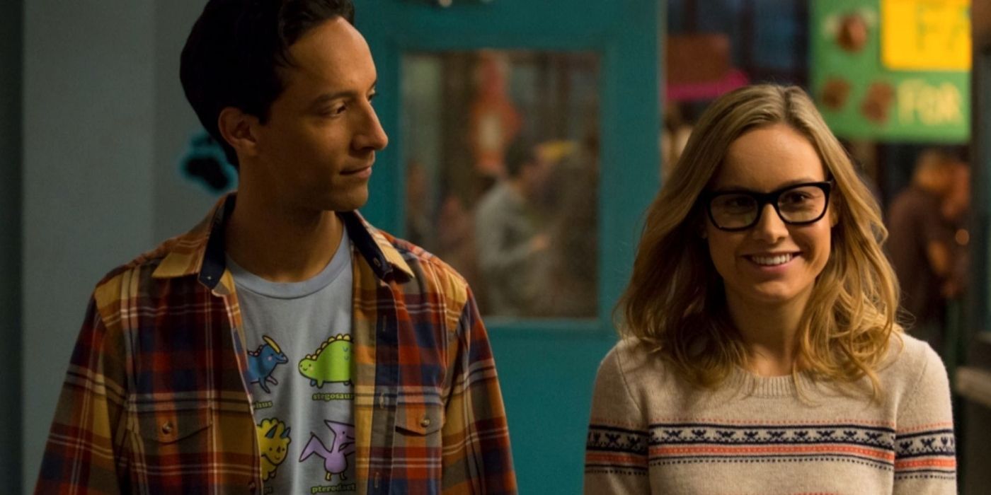 Abed looking at a smiling Rachel in Community
