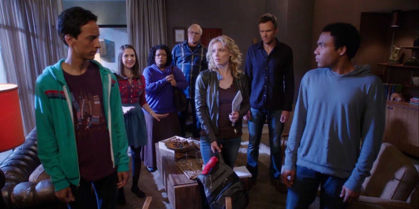 The cast of Community looking confused in a room.