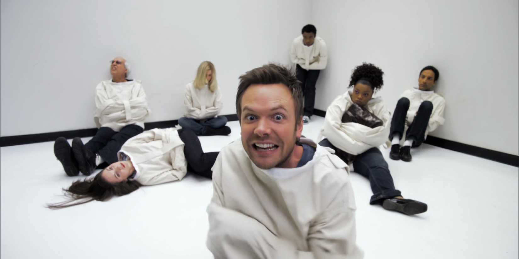 Jeff, Shirley, Pierce, Britta, Abed, and Troy wearing straightjackets in the Community episode "Paradigms of Human Memory."