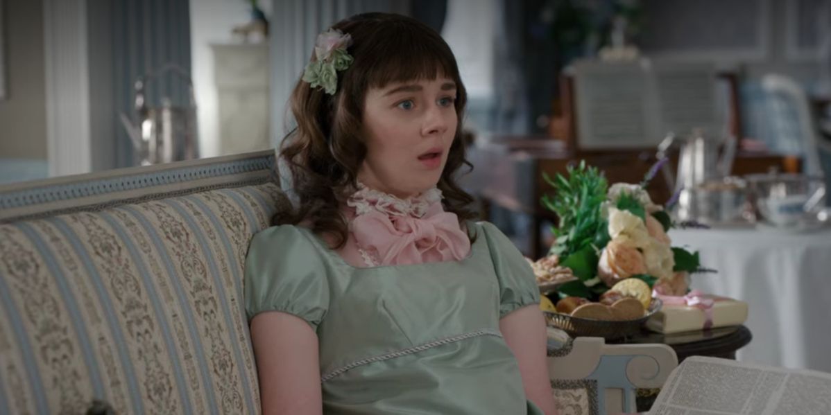 Eloise Bridgerton sitting in drawing room in turquoise dress looking shocked