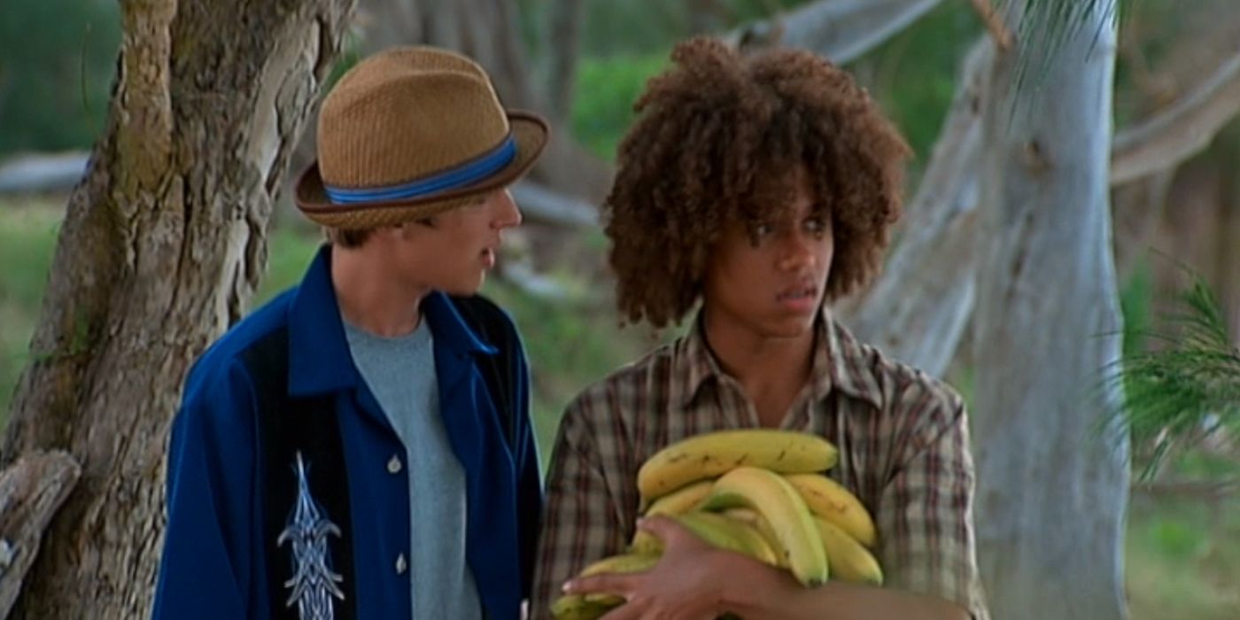 Eric talking to Nathan holding bananas in Flight 29 Down 