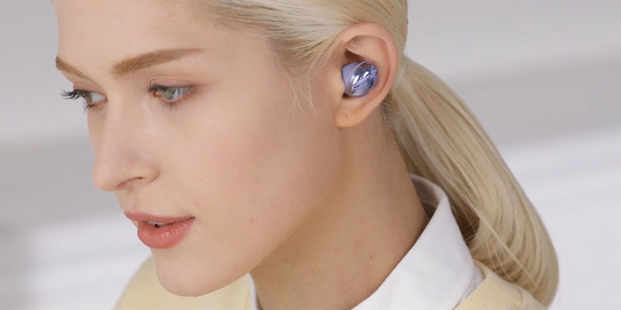 Woman wearing Galaxy Buds Pro earbuds