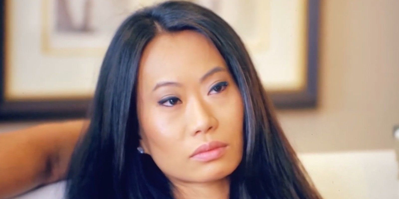 Kelly Mi Li looking off camera in a serious way on Bling Empire