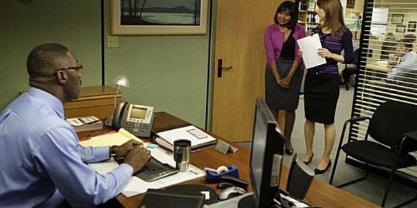 Kelly and Erin talking to Charles in his office on The Office