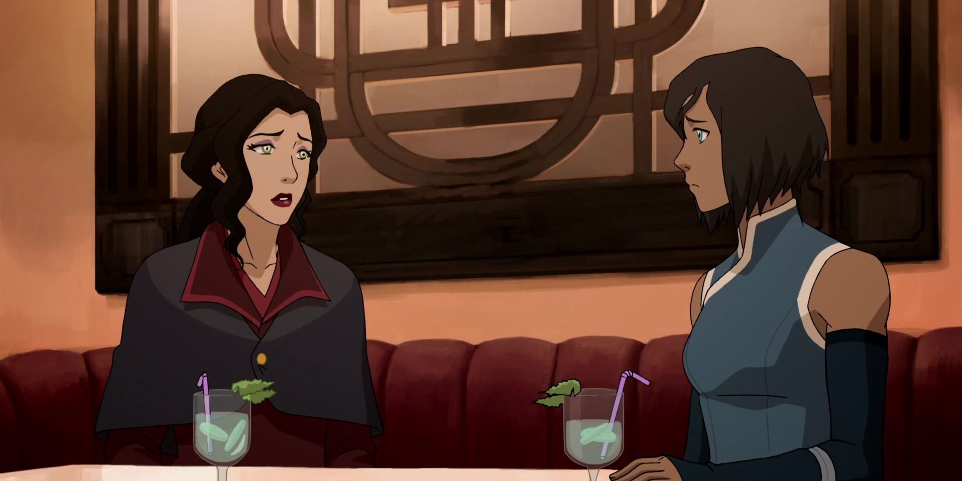 korra and asami sitting at a restaurant together