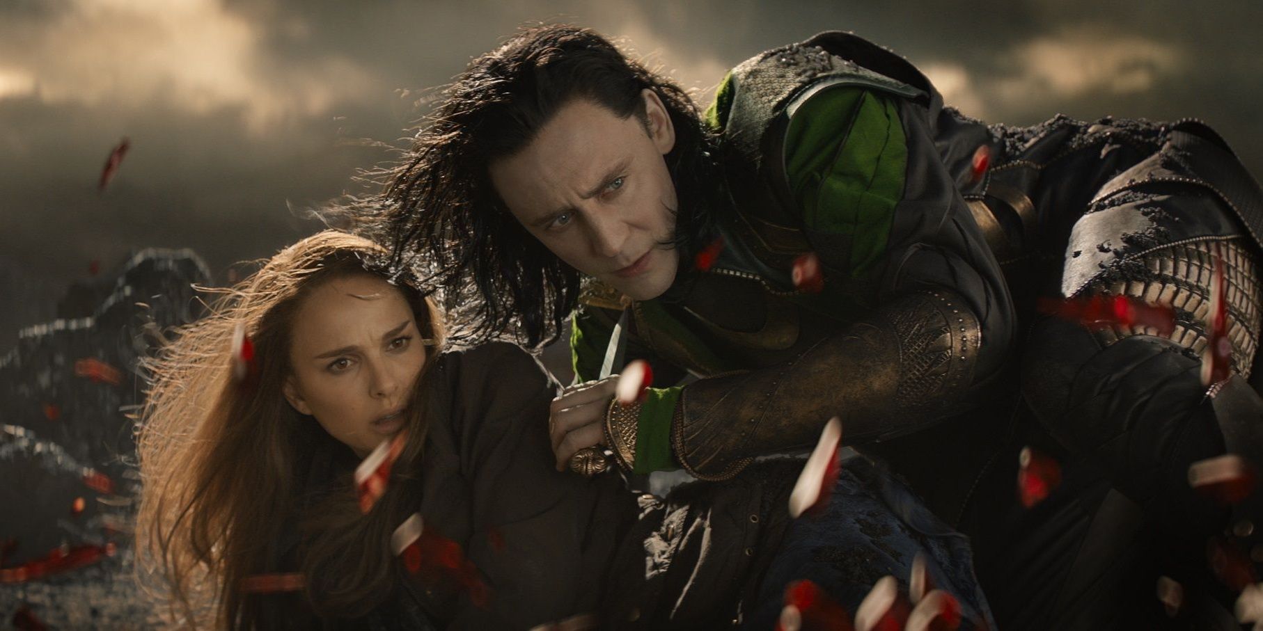 Loki holding Jane with an evil look on his face