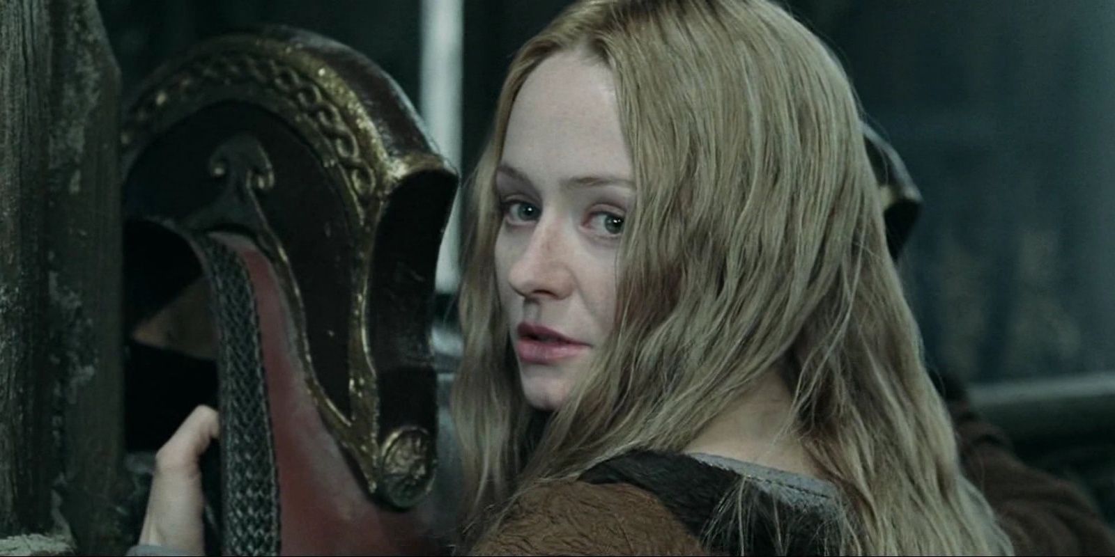 Eowyn cleaning a helmet in Lord of the Rings