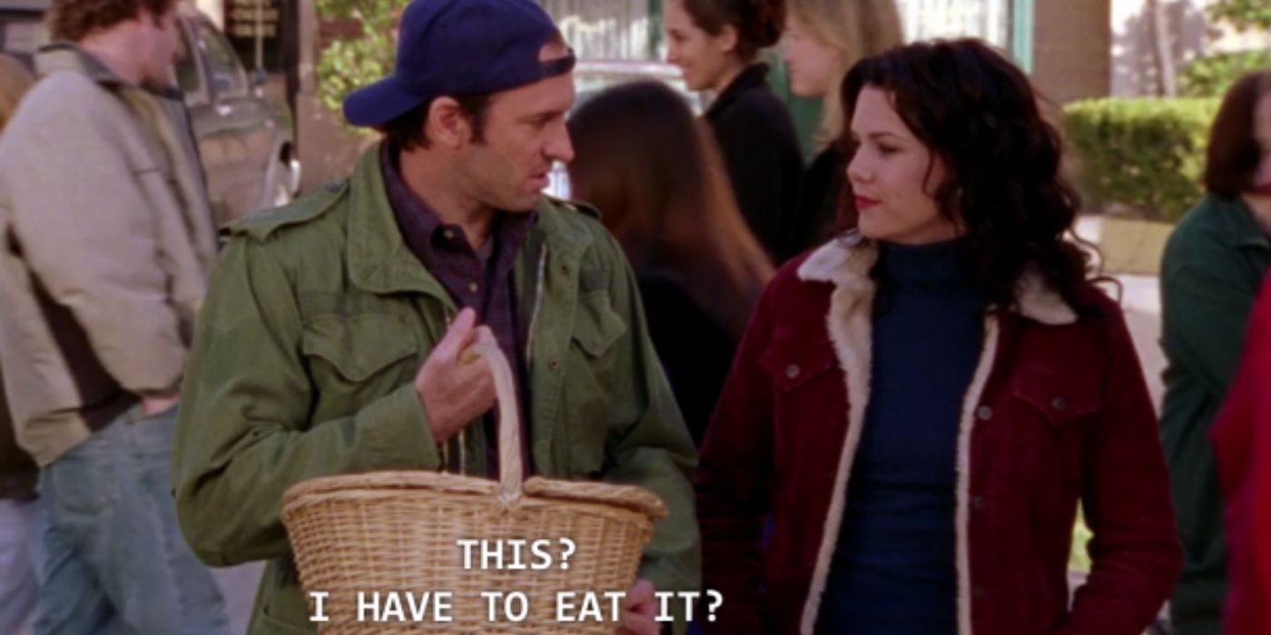 Luke and Lorelai during the basket auction in Gilmore Girls