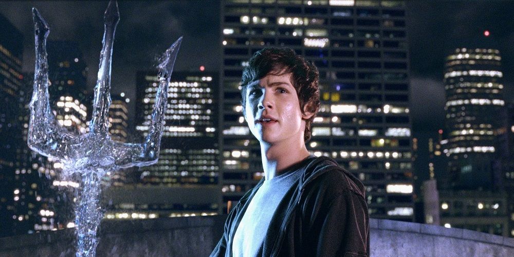 Percy Jackson standing with a trident made of water