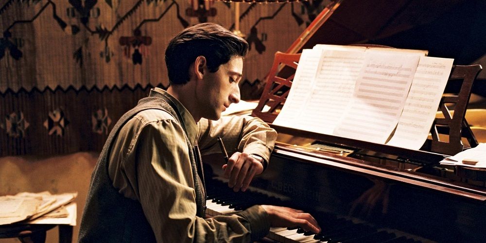Wladyslaw Szpilman (Adrian Brody) sitting at the piano in The Pianist 2002