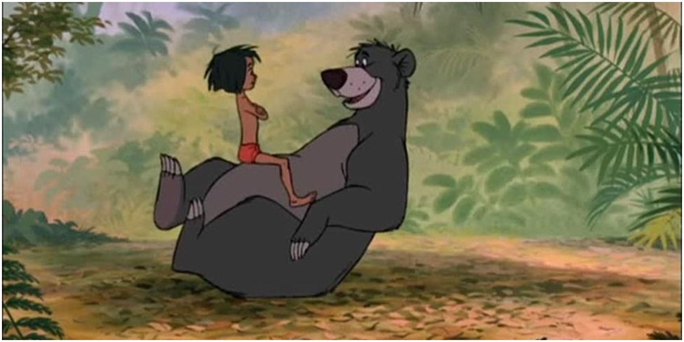 Mowgli sitting on Baloo The Jungle Book