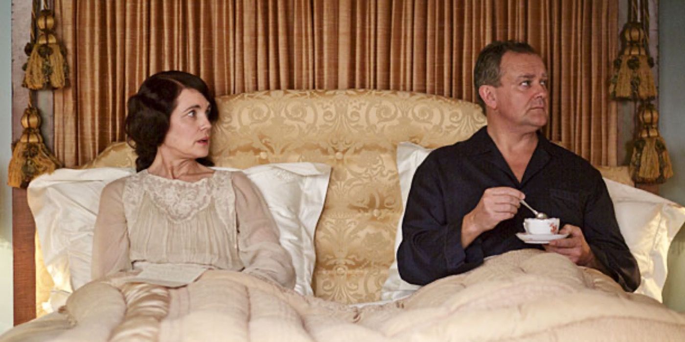 Robert and Cora sat in bed together in Downton Abbey