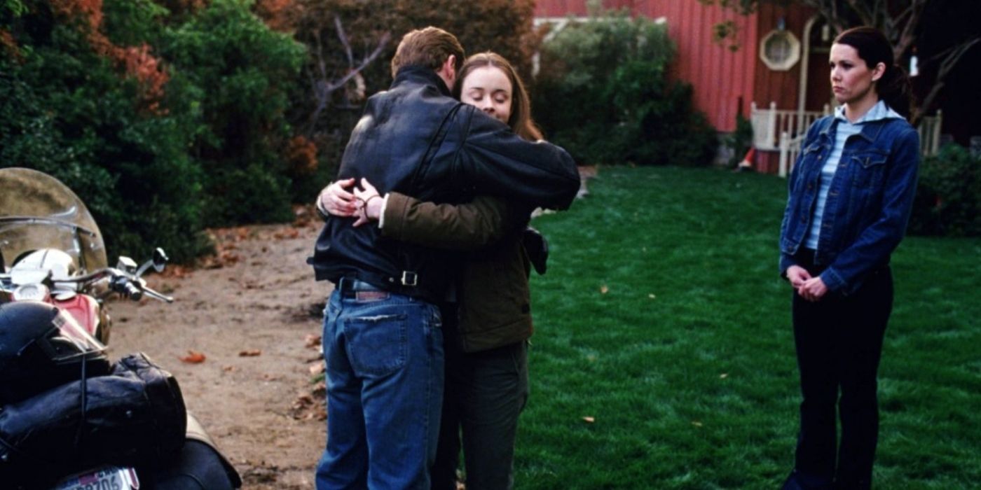 Christopher and Rory hugging with Lorelai staring on Gilmore Girls