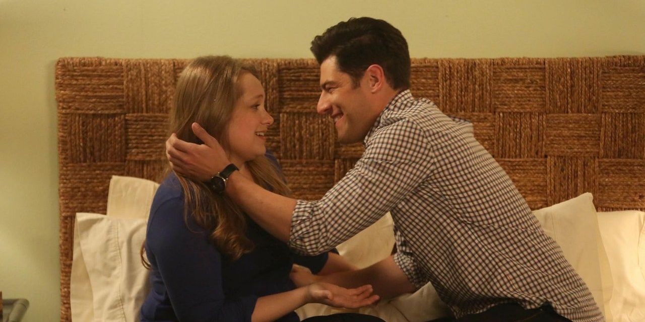 Schmidt on the bed with Elizabeth in New Girl.
