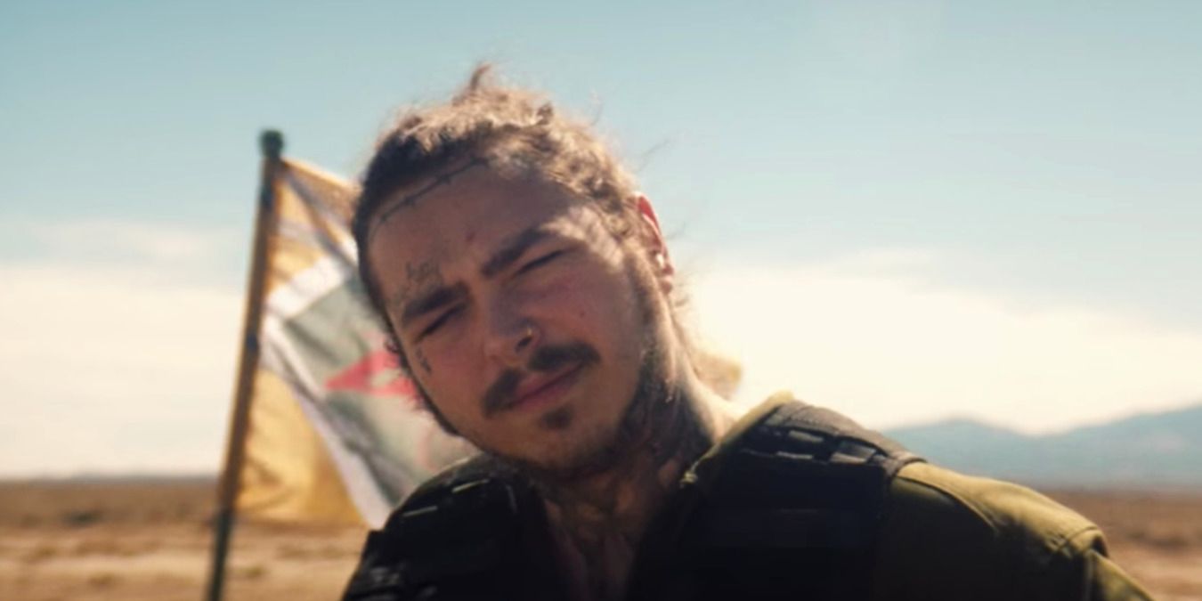 Post Malone looking into the camera during the music video for Pyscho