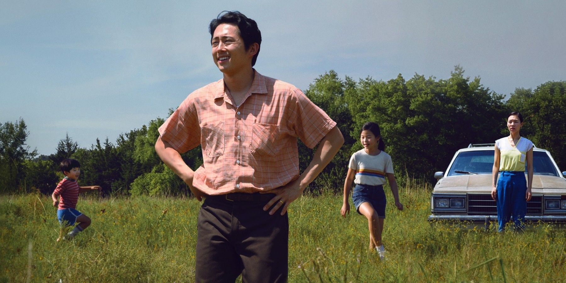 Characters played by Alan S. Kim, Steven Yeun, Noel Cho, and Yeri Han arriving at their new home in a still from Minari