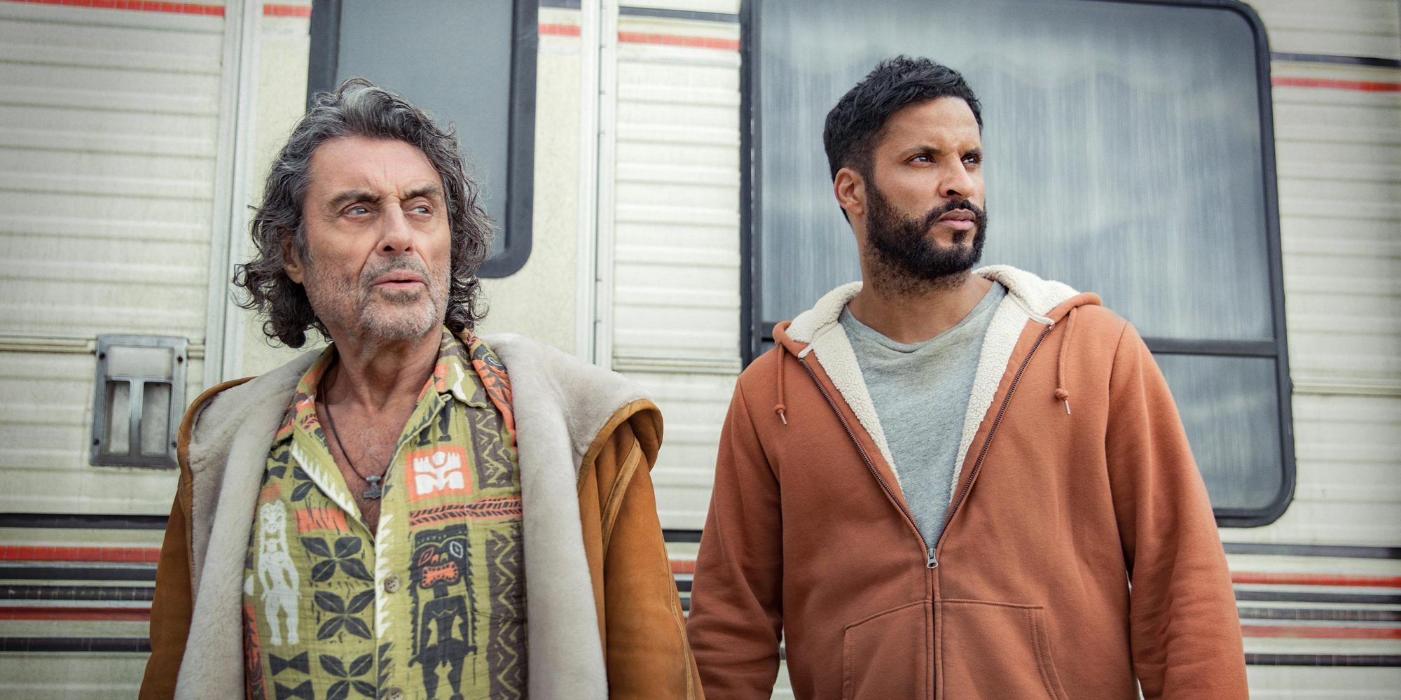 Ian McShane and Ricky Whittle outisde a trailer in American Gods Season 3