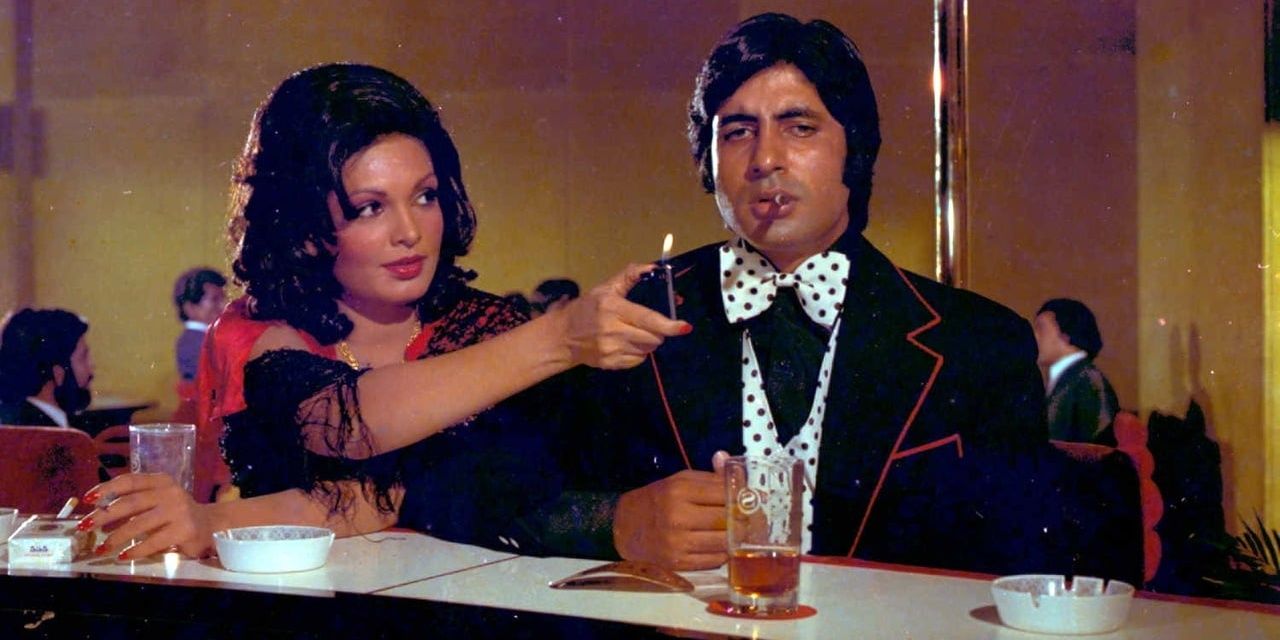Amitabh Bachchan In Deewaar, as a woman lights his cigar at a bar.