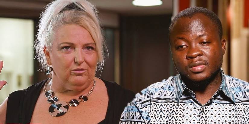 Angela Deem in black top and necklace and Michael Ilesanmi in printed shirt looking sad In 90 Day Fiance