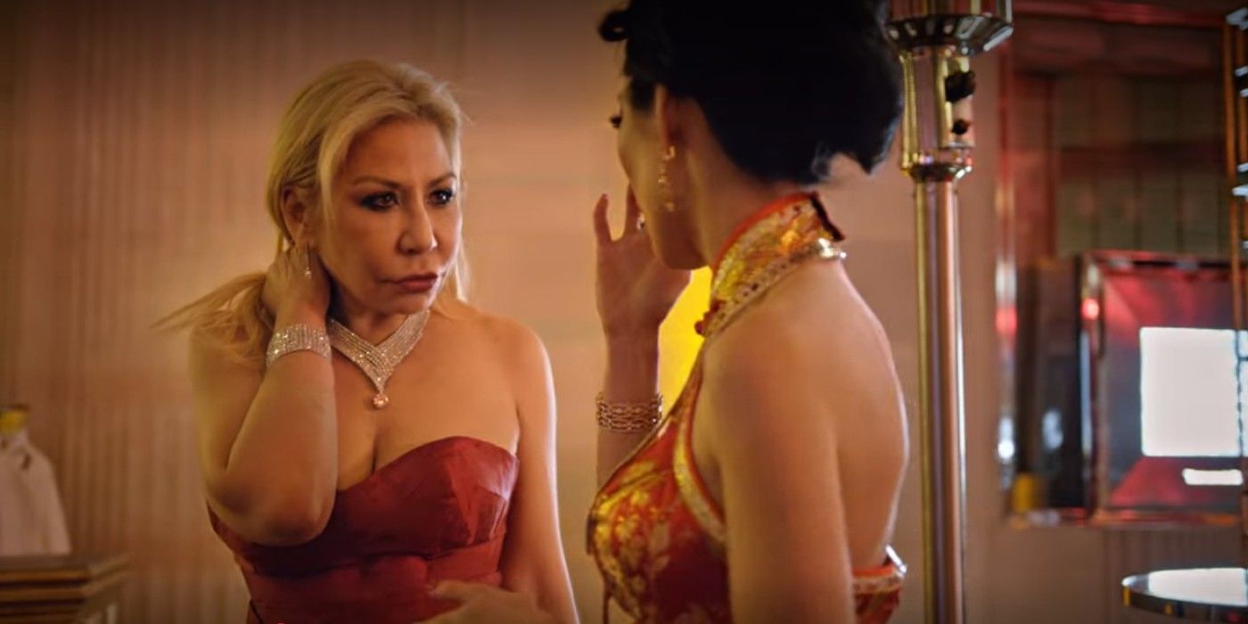 Anna Shay in a strapless red dress with her arm on her shoulders standing opposite Christine Chiu on bling empire