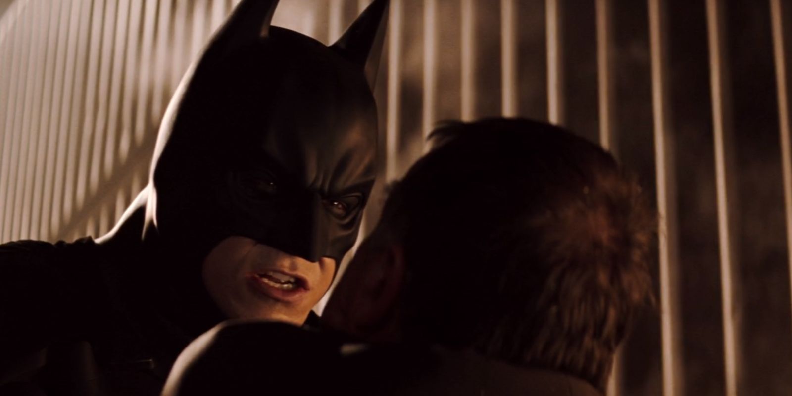 Batman intimidating Carmine Falcone in Batman Begins