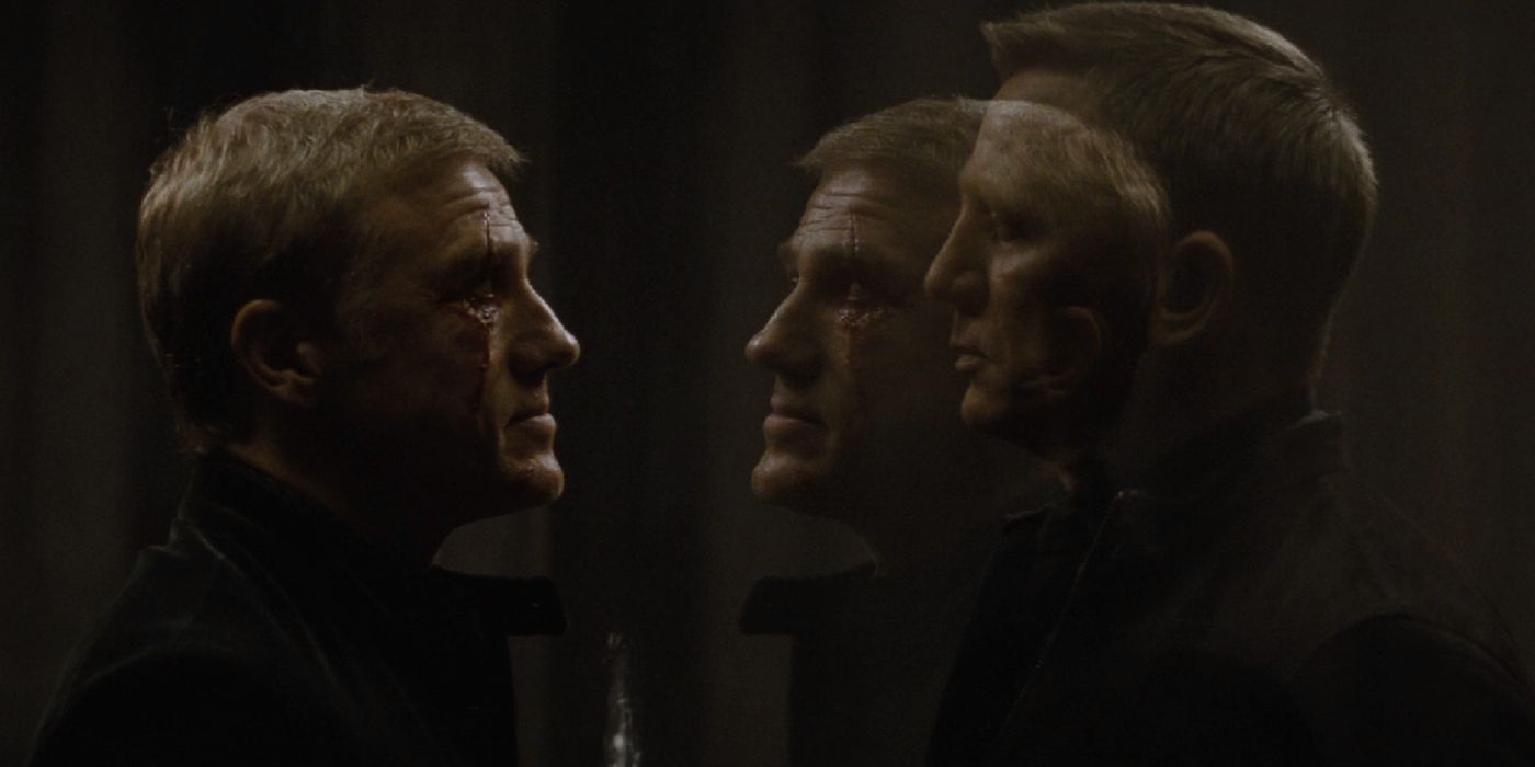 Blofeld speaking to Bond behind glass shield in Spectre