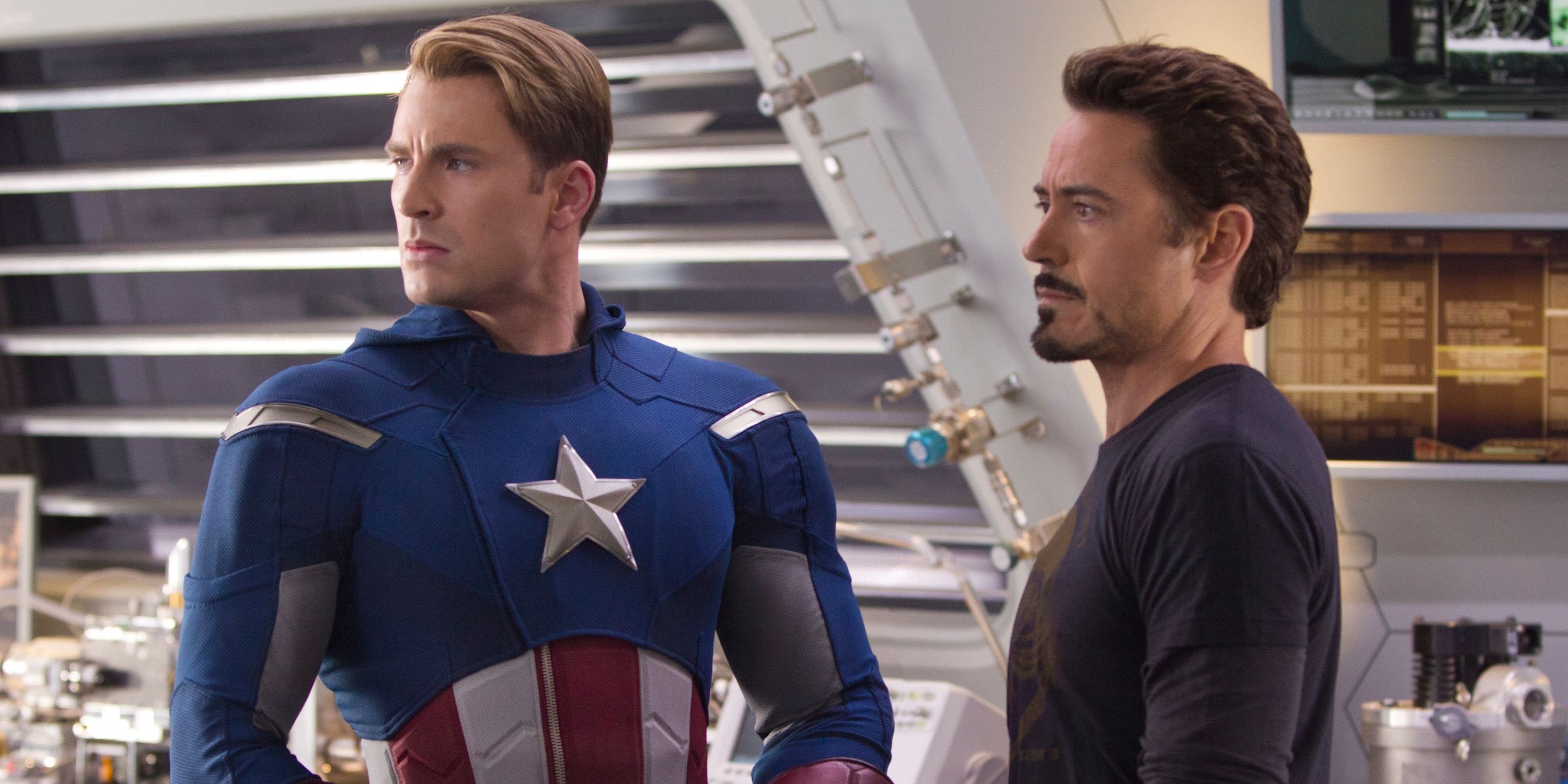 An image of Captain America and Iron Man standing next to each other. Captain America is in his uniform while Iron Man is not