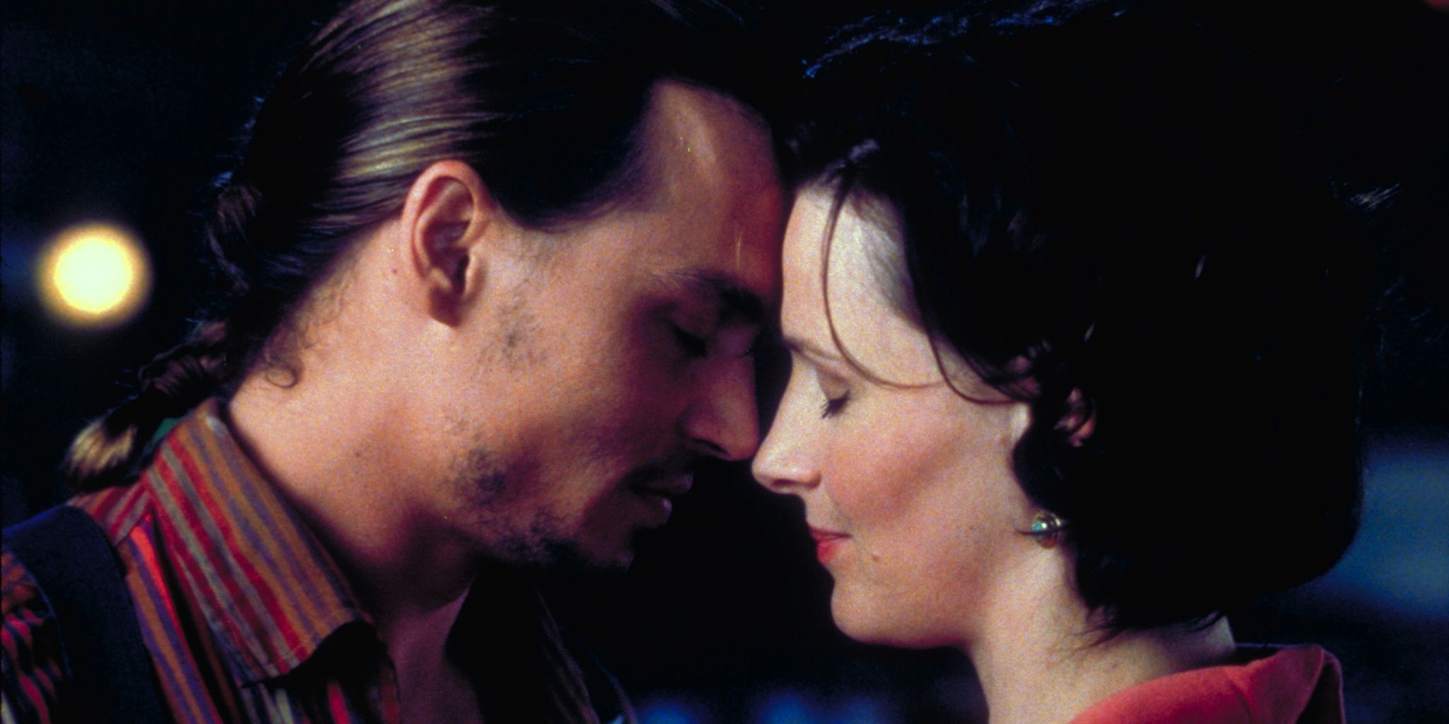 Johnny Depp and Juliette Binoche embracing in Chocolat