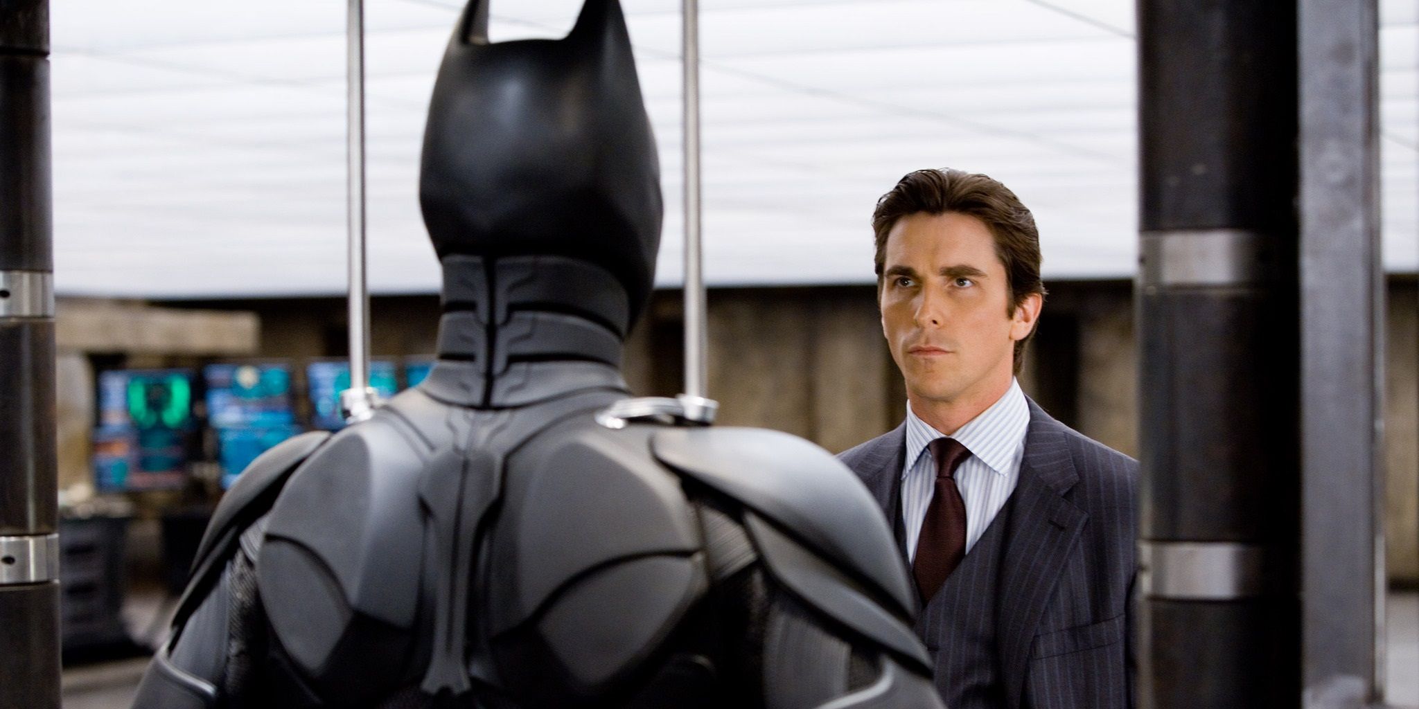 Bruce Wayne looking at his Batman costume