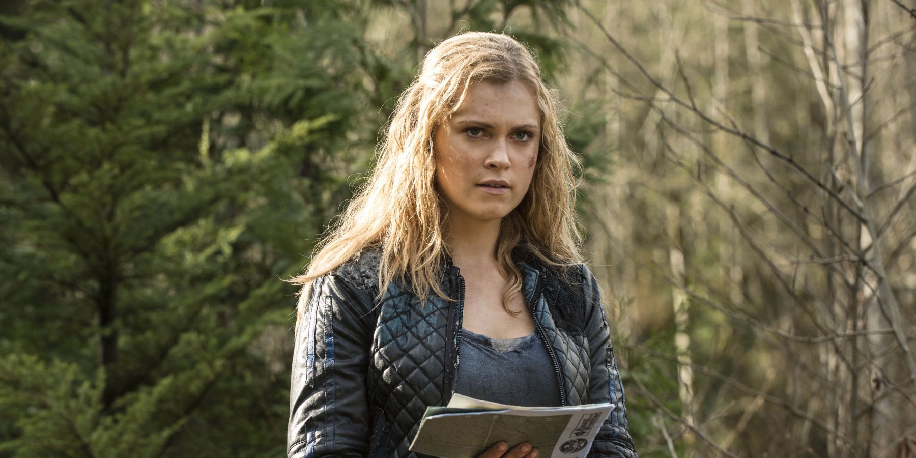 Clarke Griffin reading a map in the first season of The 100