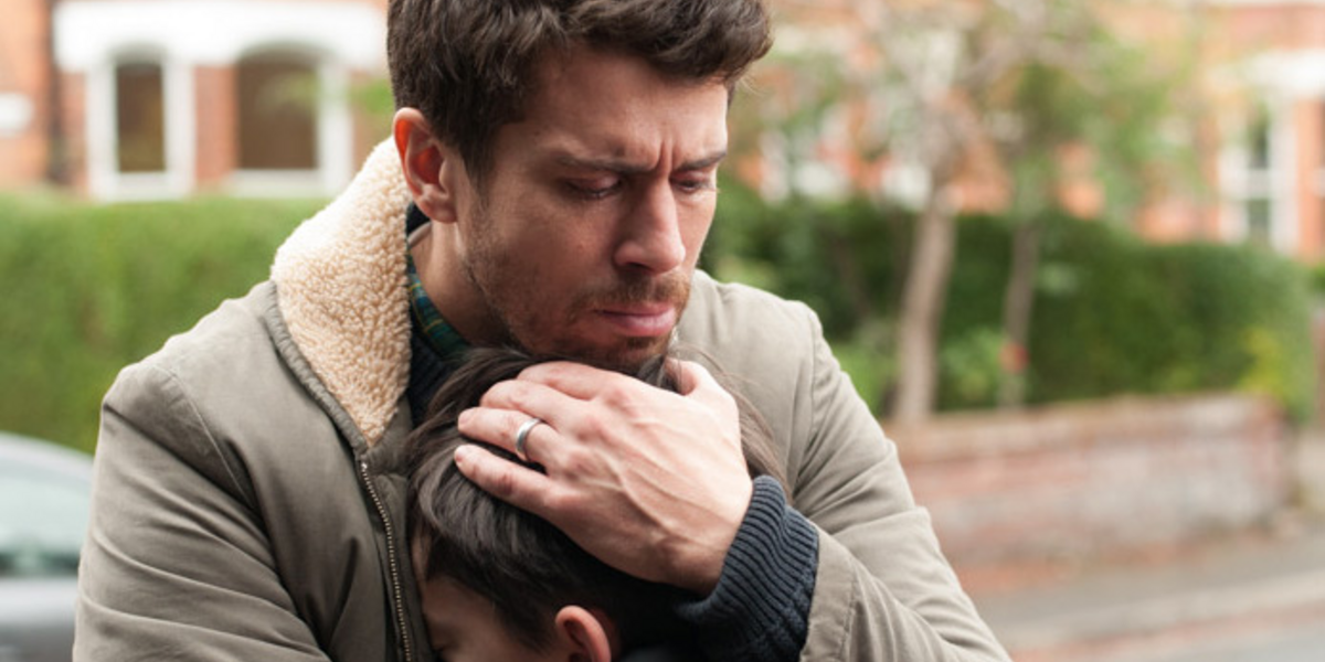 Dad hugs his son in A Monster Calls