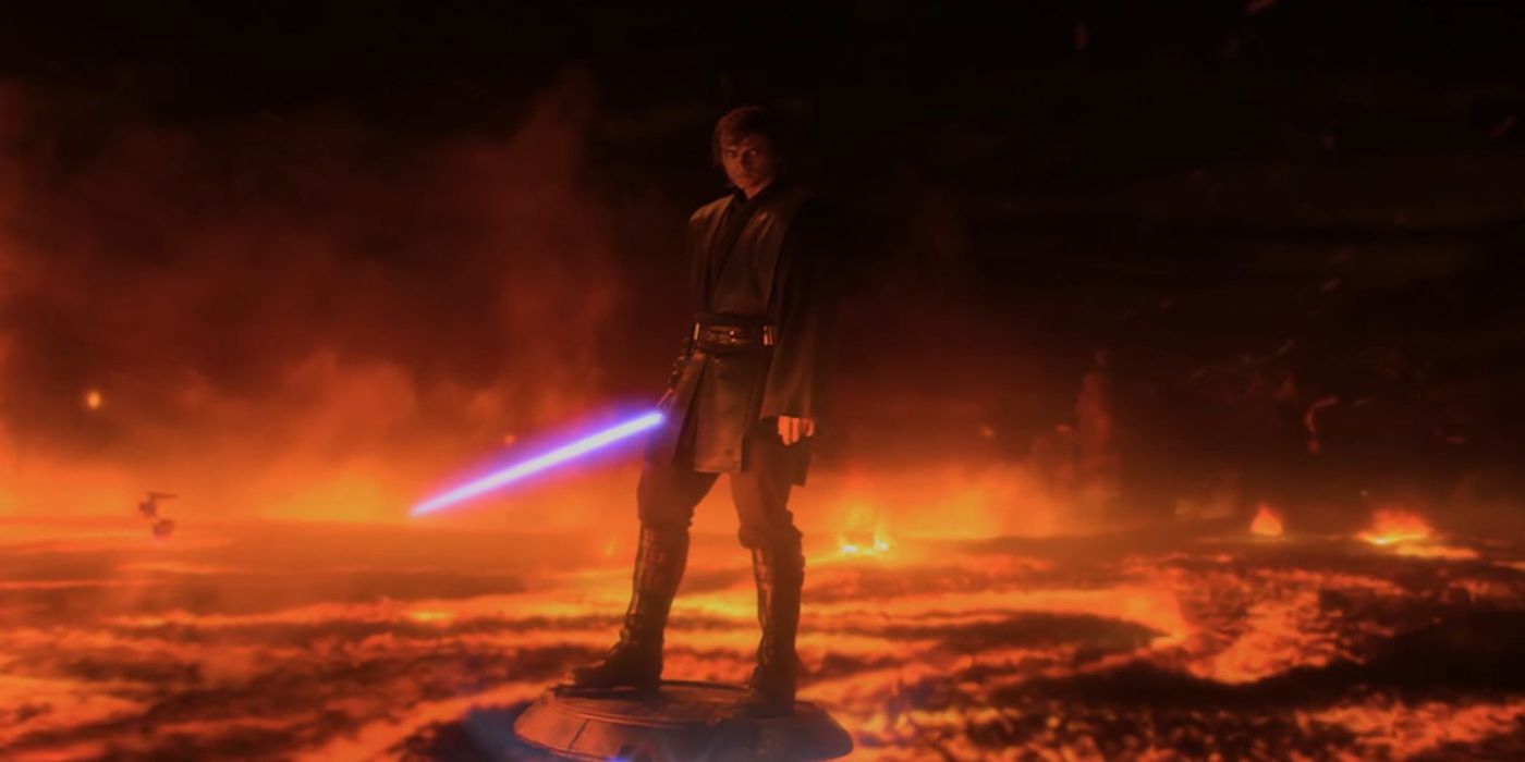 Anakin, with his lightsaber ignited, stands on rocks near a river of lava in Star Wars: Revenge of the Sith
