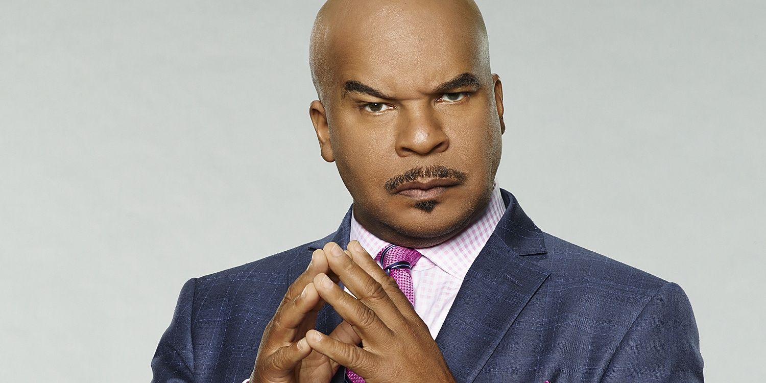 David Alan Grier posing with his finger tips pressed together in a promo image
