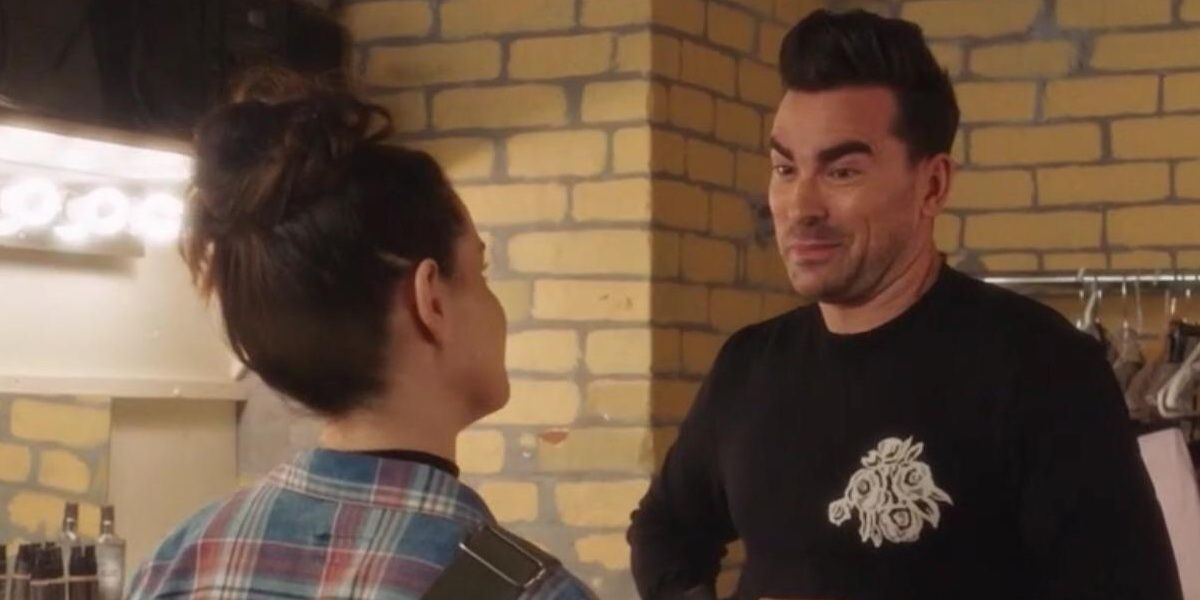 Stevie and David looking at each other in Schitt's Creek.