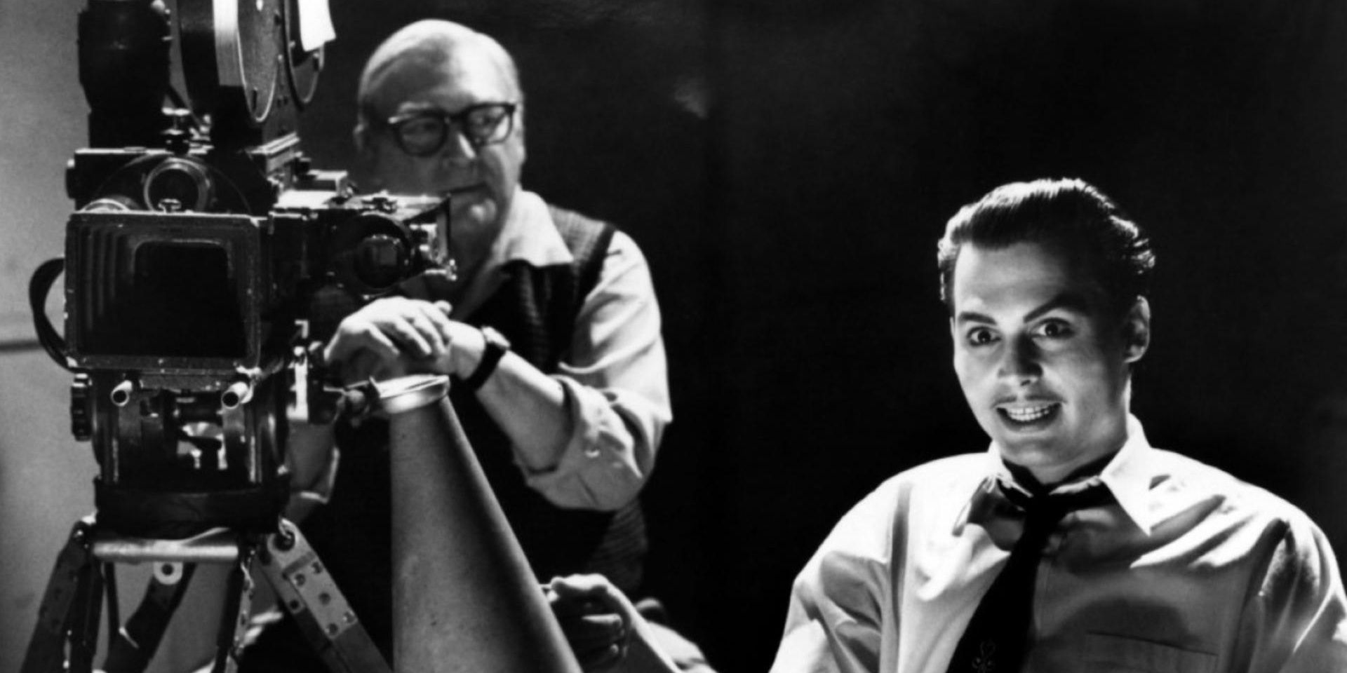 Ed Wood sits next to a camera as he directs a movie.