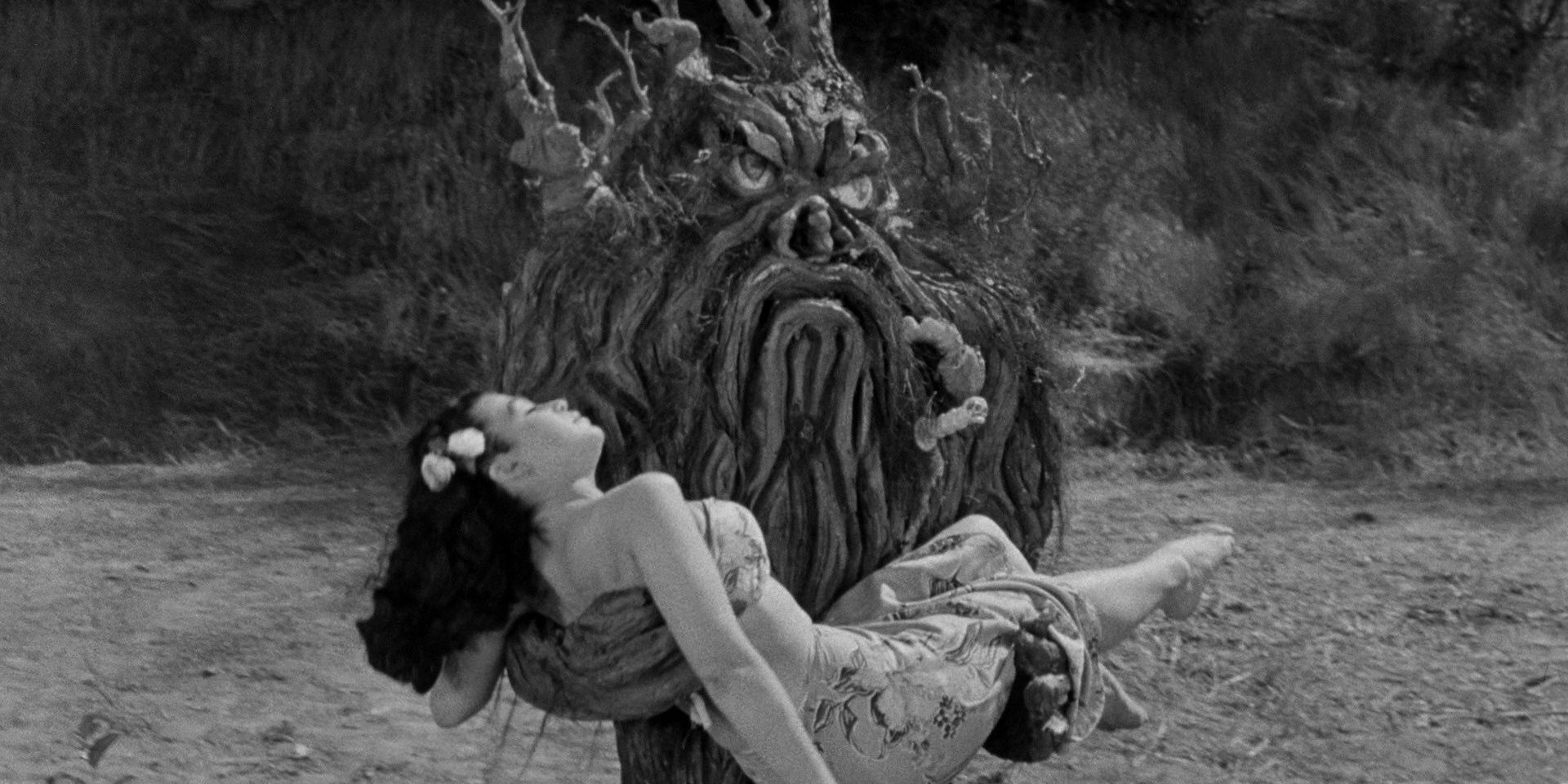The tree monster carries a girl in From Hell It Came