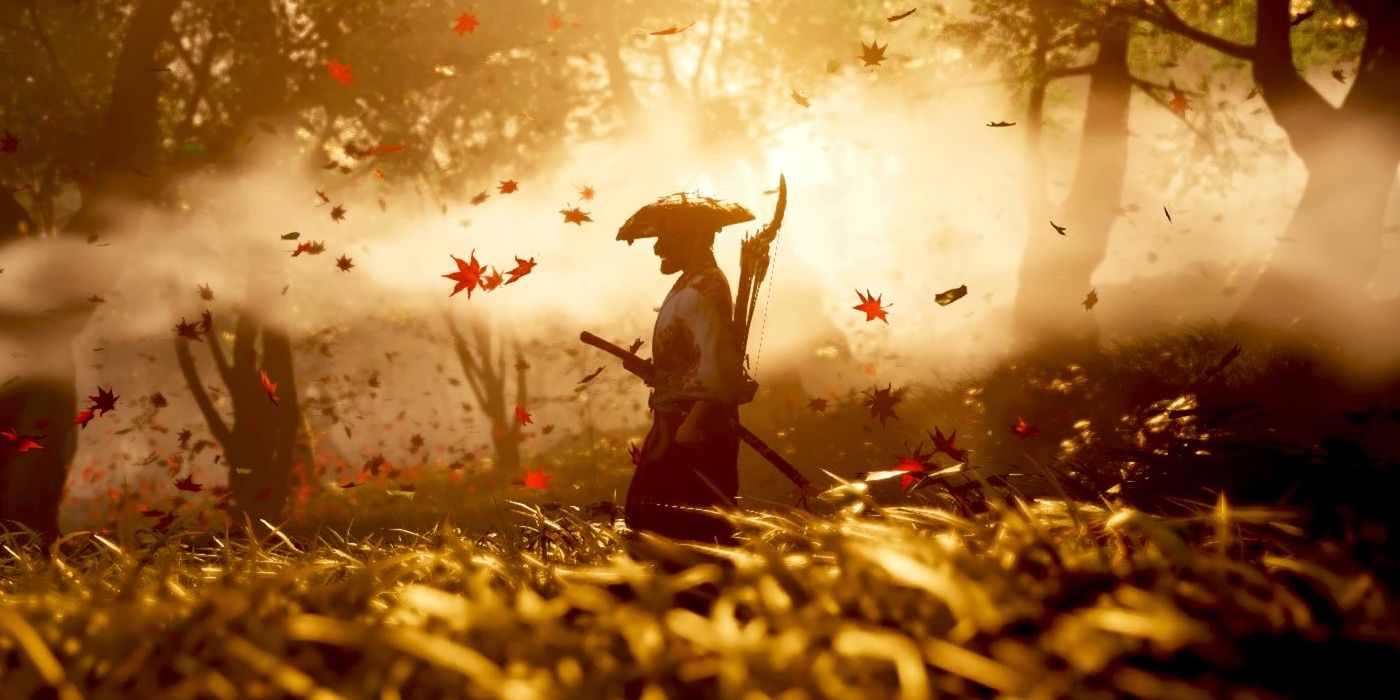 Jin walking through a field with trees, fog, and falling leaves in the background in Ghost of Tsushima.