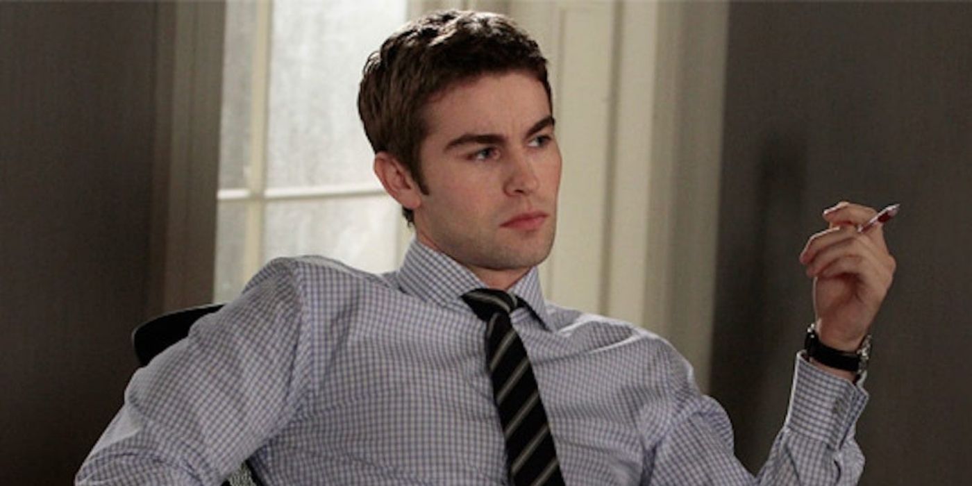 Nate Archibald sitting on his desk looking serious