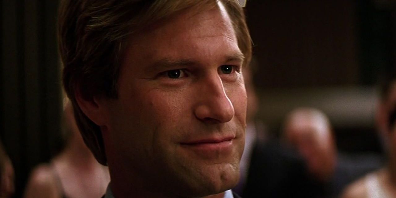 Harvey Dent smiling confidently in The Dark Knight.