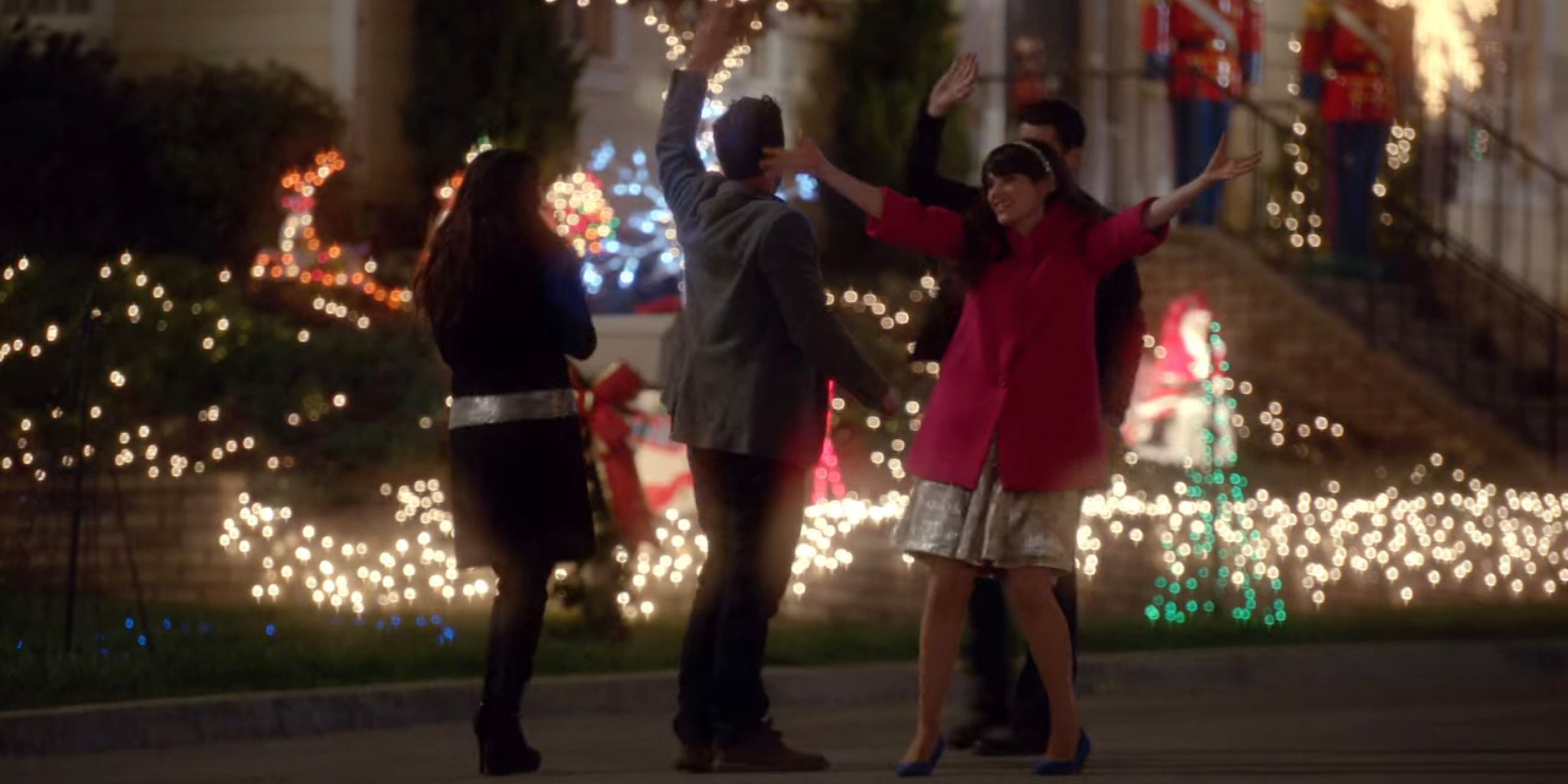 New Girl characters celebrate with Christmas lights around