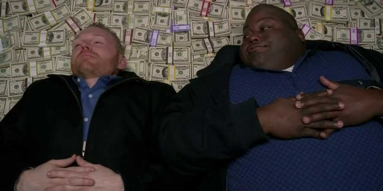 Kuby and Huell lay on a pile of money in Breaking Bad